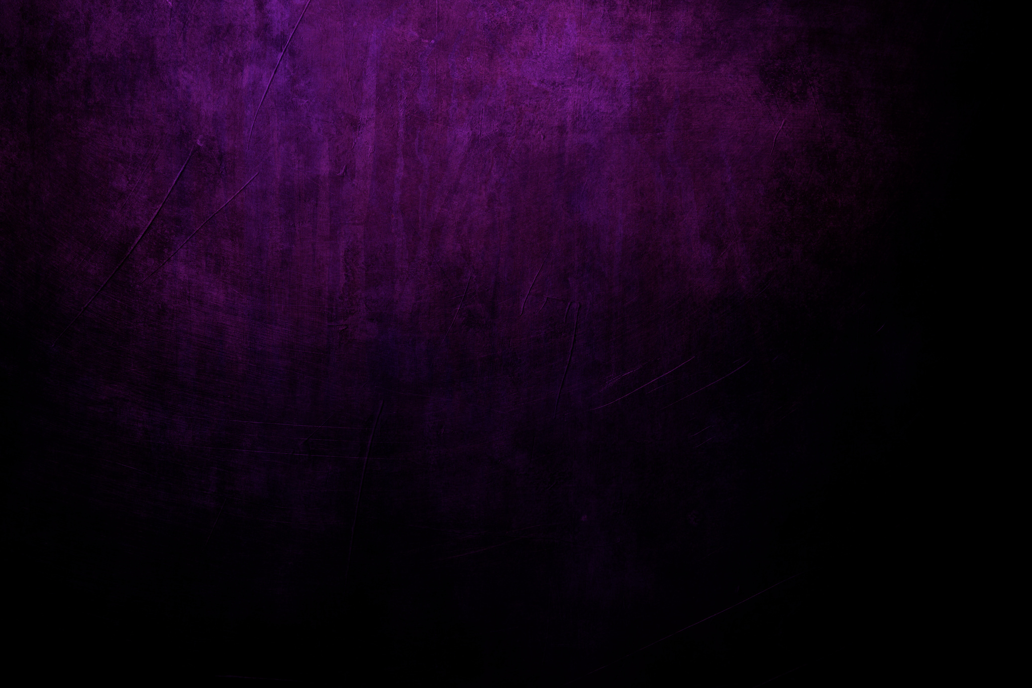 dark purple grungy background with spotlight background